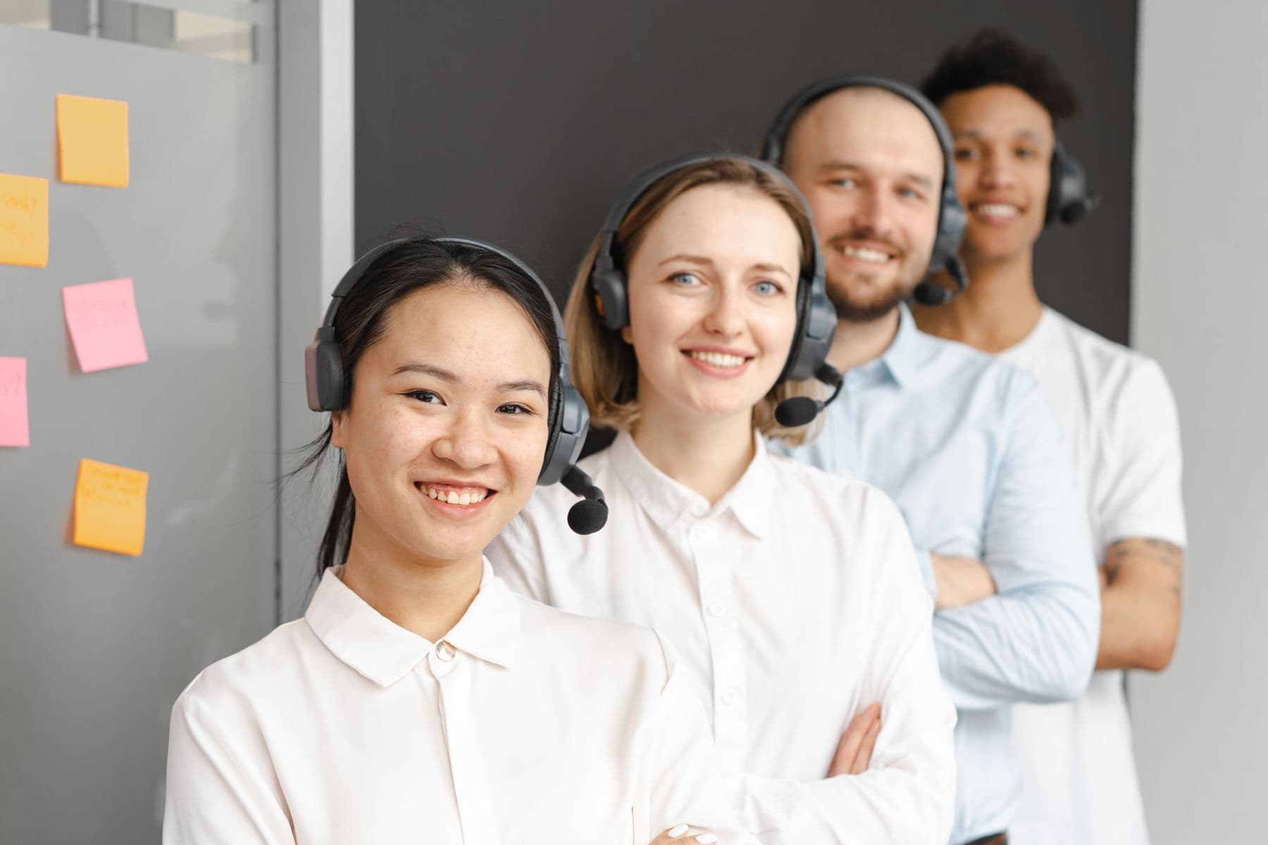 Customer-support agents wearing headsets in an office. Stock photograph, not the iGaming Operations team.